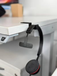 Set aus zehn selbstklebenden Headset-Haltern – ideal für Callcenter und Großraumbüros.